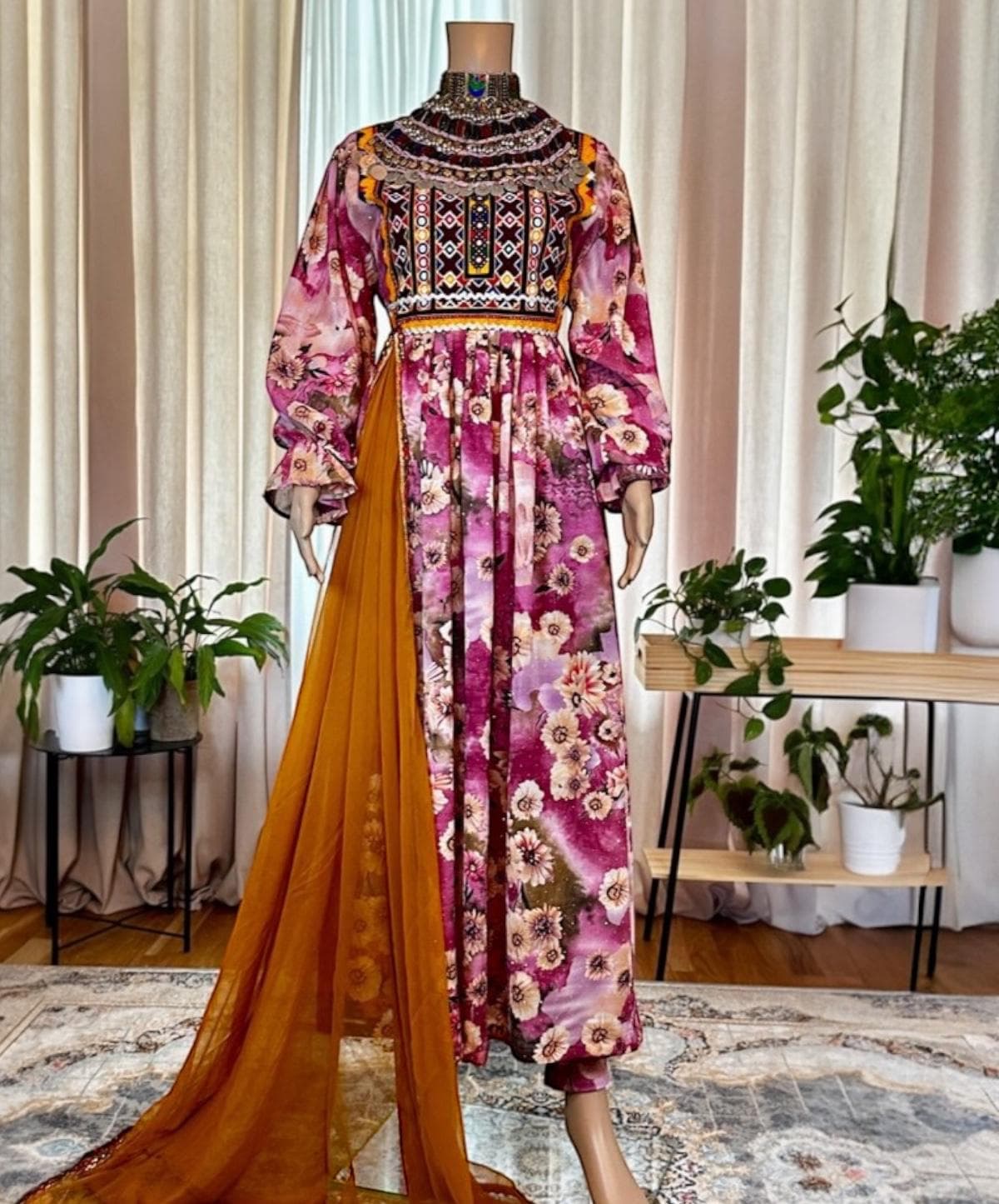 Magenta floral Afghan gown with a kuchi mirror bodice and a flowing saffron chiffon train.