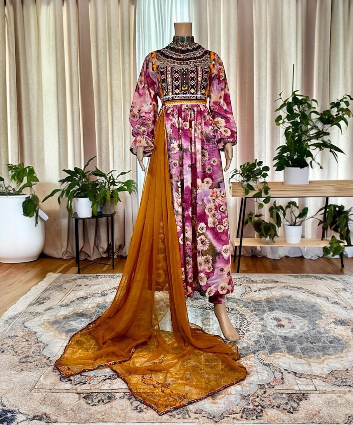Magenta floral Afghan gown with a kuchi mirror-work bodice and saffron chiffon train.